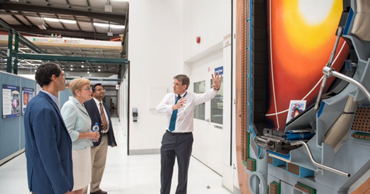 Dr. Richard Buttery explains how fusion plasmas are created in front of the at-scale cross section of the DIII-D tokamak at the DIII-D National Fusion Facility. Joining Rep. Kaptur and Dr. Buttery were Dr. Anantha Krishnan and Dr. Wayne Solomon, Vice President of Magnetic Fusion Energy.