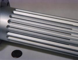Slotted corrugated waveguide for interior of high-conductance pumpout tee